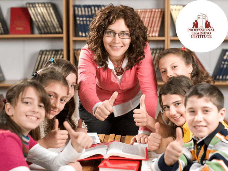 Teacher and students reading a book